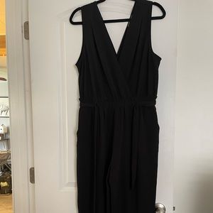 Black jumpsuit with slit up the leg until the knee